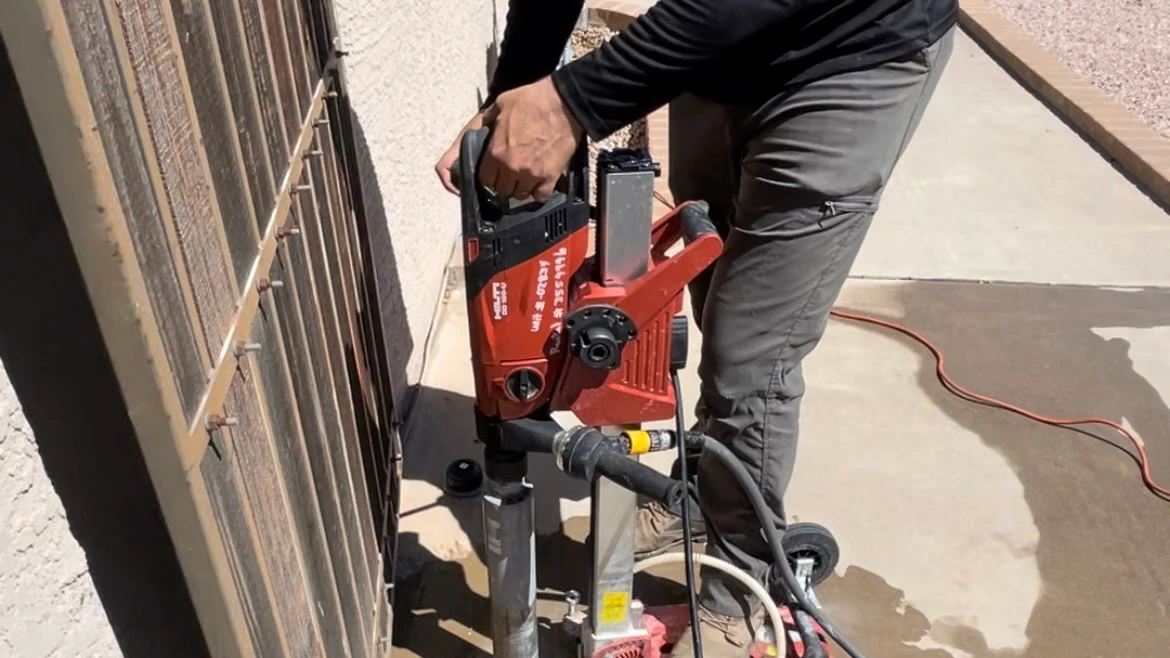 Termite bait station installation in concrete — East Valley Arizona termite treatment